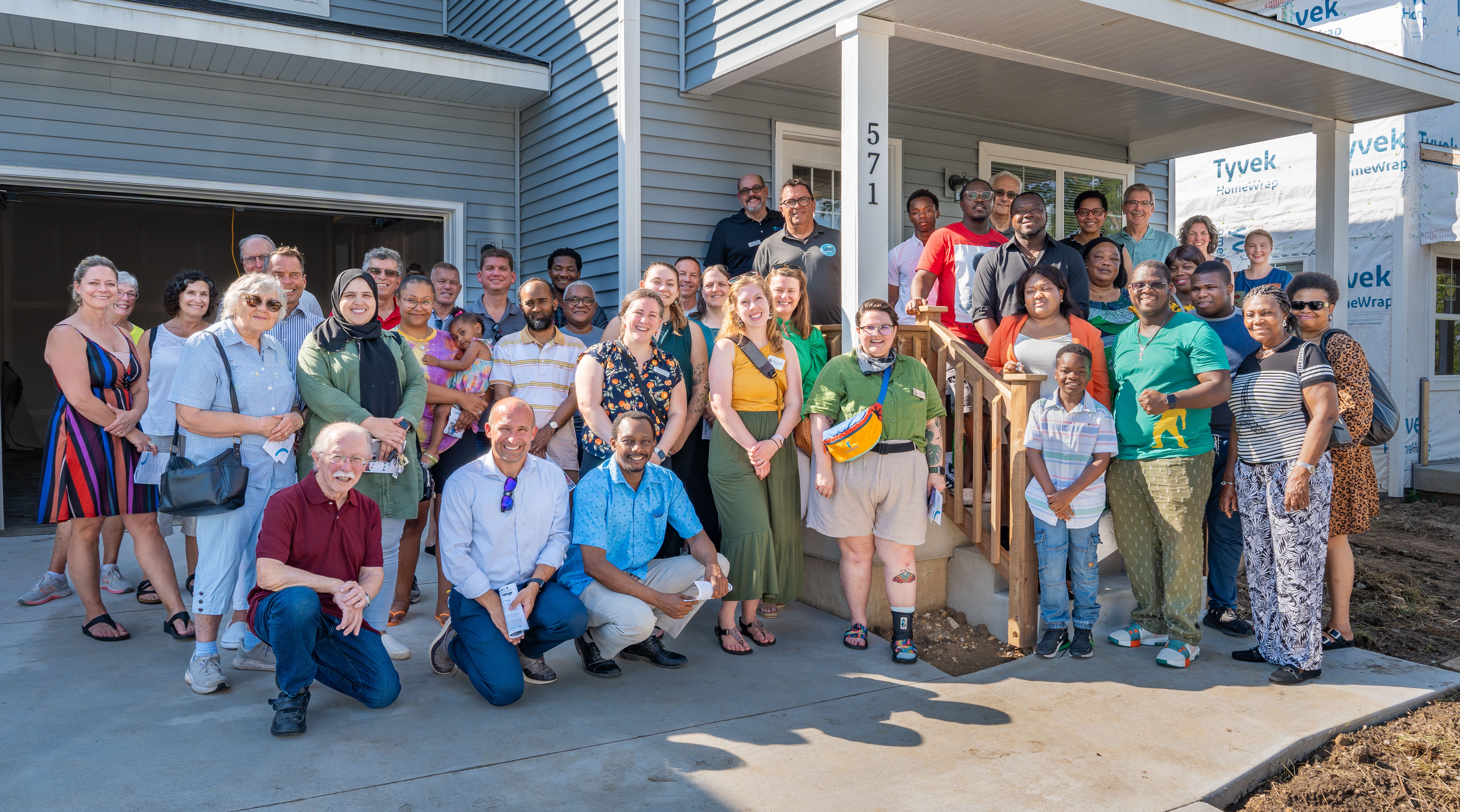 Volunteer group gathered in driveway