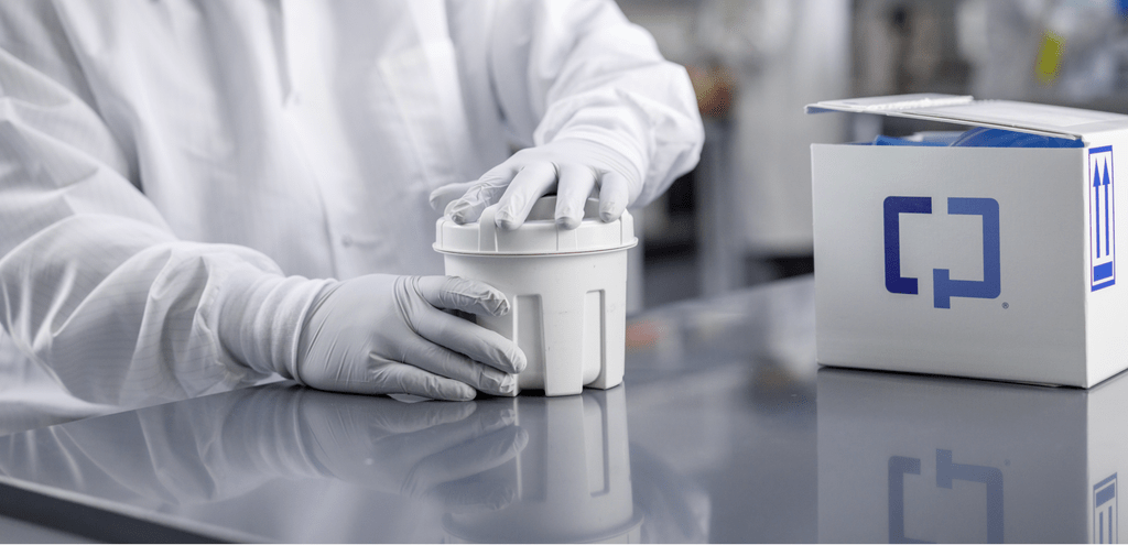 A lab worker opening a plastic Cologuard container